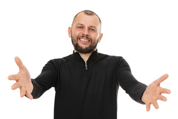Fototapeta premium Portrait of thirty year old man with open arms for hug, isolated on white background. Cheerful expression embracing happiness. Bearde caucasian man in blackturtleneck smiling and posing in studio.