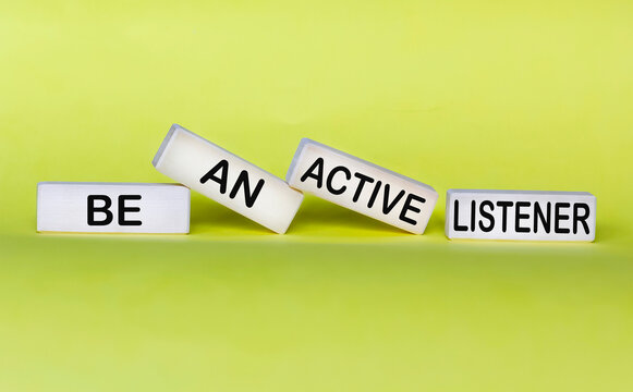 Wooden Blocks With The Inscription Be An Active Listener On A Yellow Background.