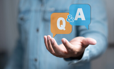 business hand clicking Q&A or Question and Answer button. Business woman holding posts in Q&A....