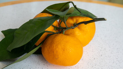 close up view of rip Tangerines with leaves. Isolated. Organic farm products, close up Orange...