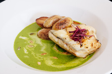 fancy food respaurant  white fish on wthite plate