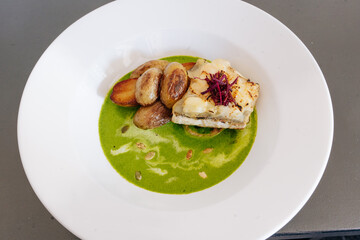 fancy food respaurant  white fish on wthite plate