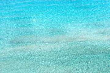 Sea water background texture. Aerial drone view of Elafonisi island, Greece. Ad template, copy space