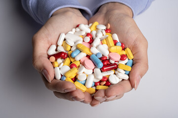 Woman Hands full of various pills. Healthcare or medical concept. - obrazy, fototapety, plakaty