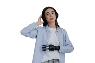 beautiful European girl listens to music, puts on an earphone, another hand is mechanical, and she knows how to use for everyday life.people with artificial limbs after surgery .