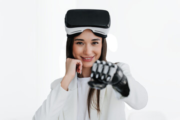 European cute brunette girl with bionic arm in white suit with vr glasses on her forehead, makes...