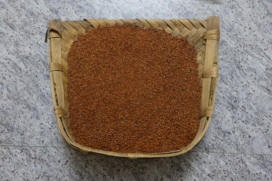 Ragi or finger millet in a dust pan