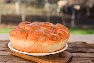 Close-up of fresh  traditional  artisan homemade round  bread . Bulgarian tradional holiday bread