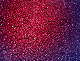 Water drops on a metallic background