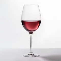 Fotobehang Red wine in glass close up white background © Magdalena Wojaczek