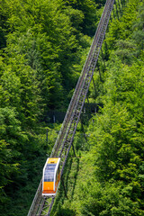 Funicular is a rail vehicle with cable traction for transporting people