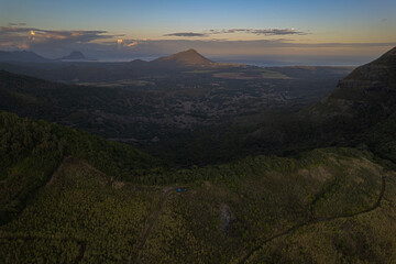 Aerial HDR view of Trois mamelles mountain and the west coast of Mauritius island during a full moon at dawn