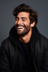 Obraz premium Portrait of handsome smiling young man. Laughing joyful men with crossed arms 