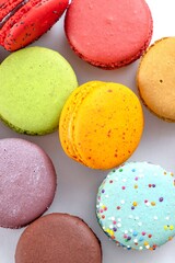 Fototapeta na wymiar 4K Ultra HD Close-Up Image of Colorful Macarons on White Background - Culinary Delight