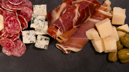 Cheese, olives, salami, jamon isolated on a white backgrund.