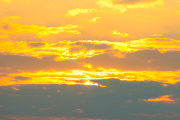 Sunset sky with sunset clouds, sun rays and dramatic sky