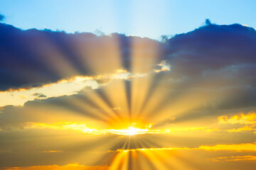 Fototapeta premium Sunset sky with sunset clouds, sun rays and dramatic sky
