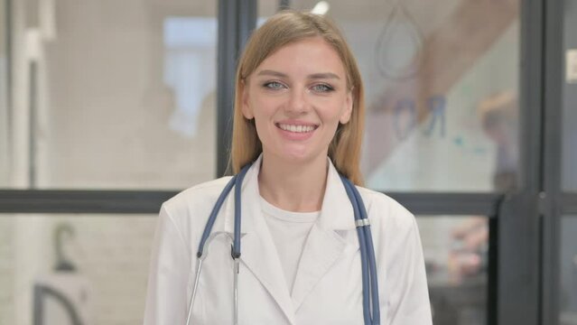 Portrait of Smiling Blonde Female Doctor