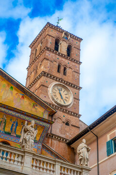 Rome, Italy - February 21, 2023: Clocktower of the Basilica of Santa Maria in Trastevere, Rome, Italy