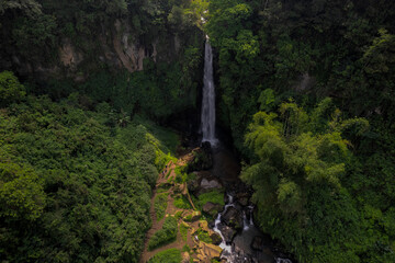 Aerial HDR view of Coban Talun waterfall during an afternoon in East Java, Indonesia