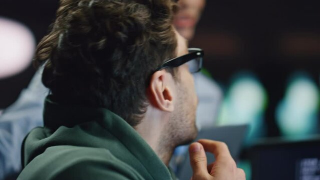 Software developer asking colleague woman discussing work at datacenter closeup