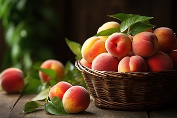 Naklejka na ściany i meble basket full of ripe sweet peaches on wooden table on a rustic blurred background