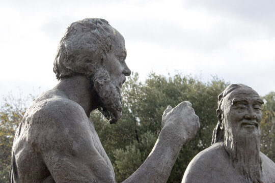 Statue of Socrates and Confucius inside the Ancient Ruins in Athens Greece