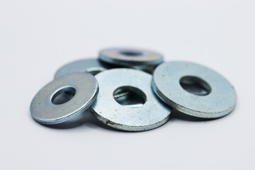 Fasteners. Metal washers on a white background