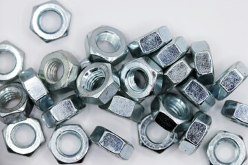 Fasteners. Metal nuts on a white background