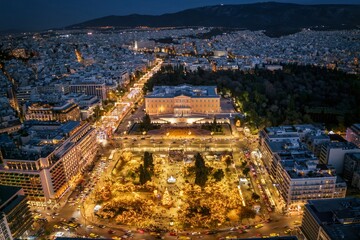 Aerial view of the festive decorated Syntagma Square for Christmas in front of the Parliament building during night time, Athens, Greece