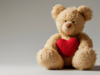 teddy bear with red heart on a light background