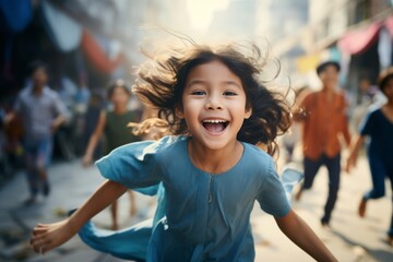 happy asian child girl running on the background of a crowd of people