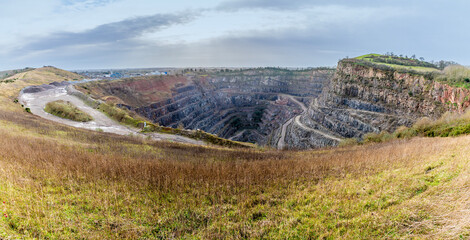 A panorama view towards Croft Hill and Croft Quarry from Huncote Nature reserve in Leicestershire, UK on a bright sunny day