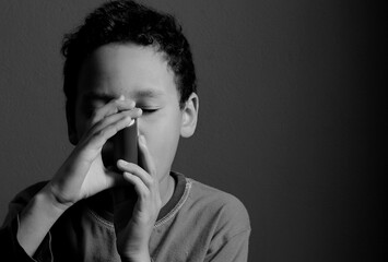 child with flu and inhaler respiratory puff on grey background with people stock photo  - obrazy, fototapety, plakaty
