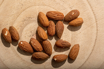 Almonds nuts close up on a textured background wood hessian