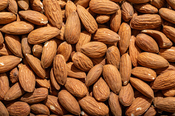almonds nuts as a background wood hessian