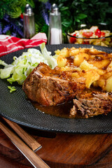Stewed pork neck in sauce.