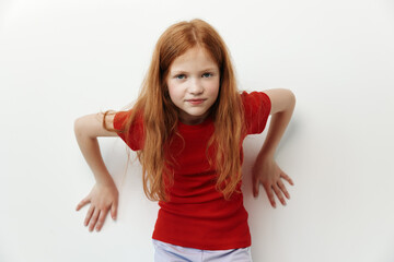 Indoor redhead face portrait little female children girl red expression isolated caucasian...
