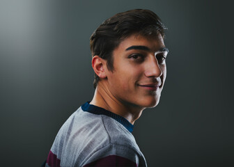 Over-the-shoulder smile, carefree young adult's charm