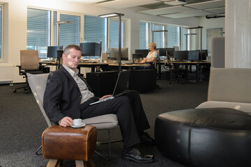 Employees at work in a modern IT office