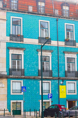Lisbon, Portugal - December 11, 2023: Old colorful and beautiful facades. The building in blue color is tiled with carved balconies. Villa Sousa.