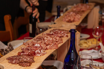 Abundant Spread Featuring Long Serving Board of Salami Crudo and Soppressata Slices