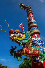 A colorful dragon on an Asian temple. Thailand