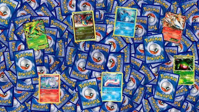 Collection of pile of authentic used Pok&eacute;mon trading cards banner heading, collectable Japanese game.