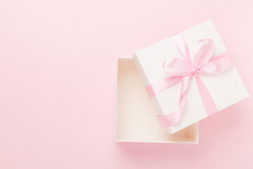 White open gift box on color background, top view. Mock up for design