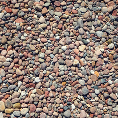 Top view of round sea stones floor. Square photo