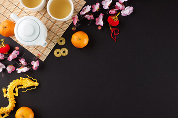 Elevating celebrations through the chinese New Year tea ceremony. Top view shot of teapot, cups of...
