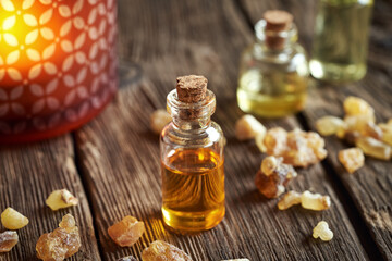 A transparent bottle of frankincense essential oil with boswellia resin