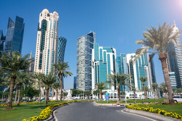 Fototapeta na wymiar Al Dafna Park, Doha, West Bay, Qatar - View of Doha skyscrapers with palms