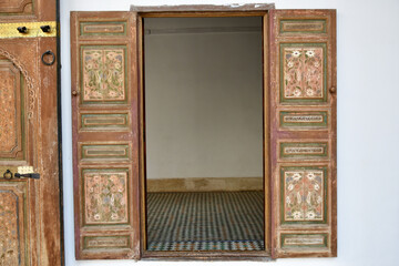 Window with Vintage Wooden Shutters with View of Interior Moroccan Floor Tile 